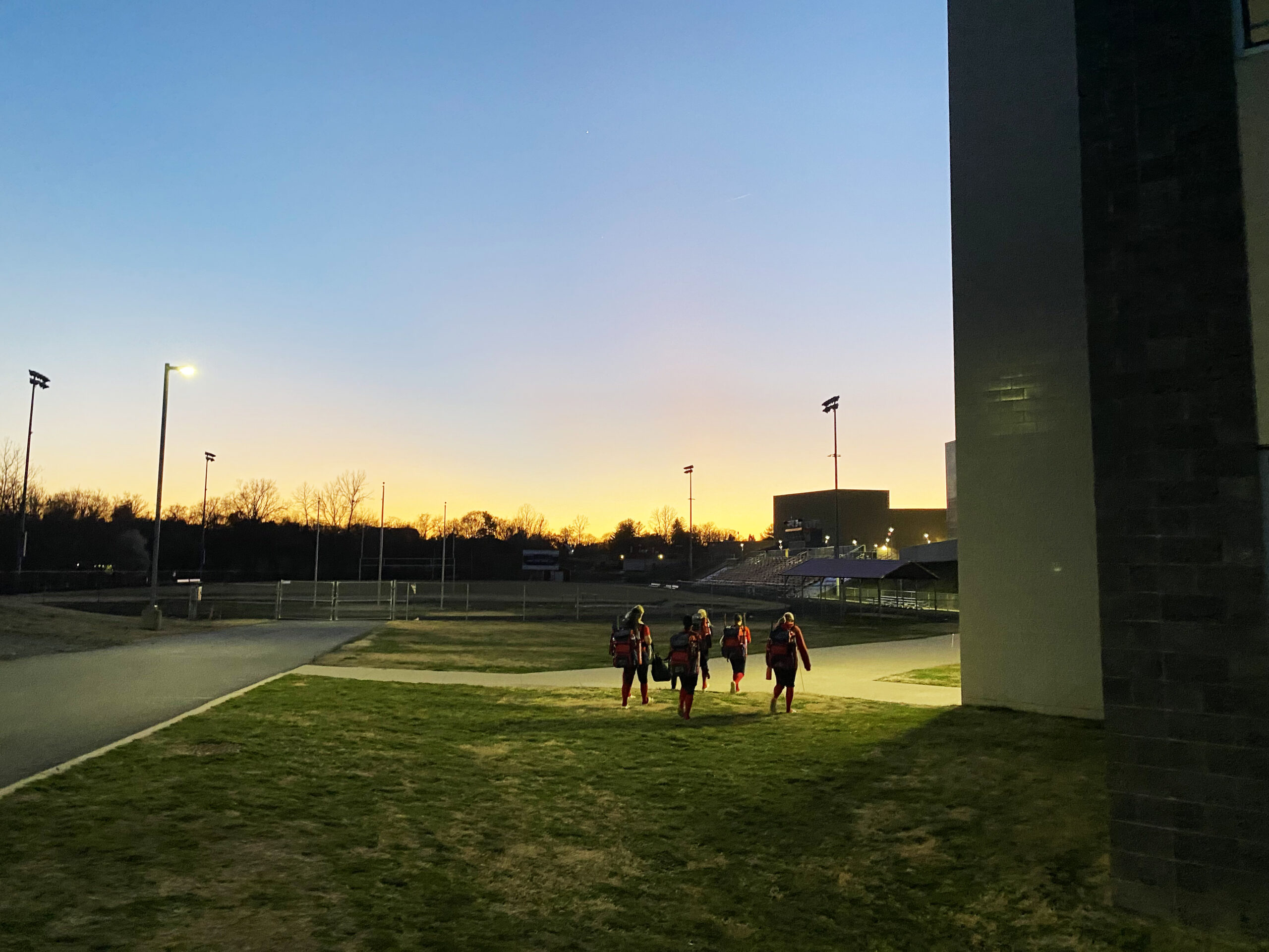 Students leaving practice at night.