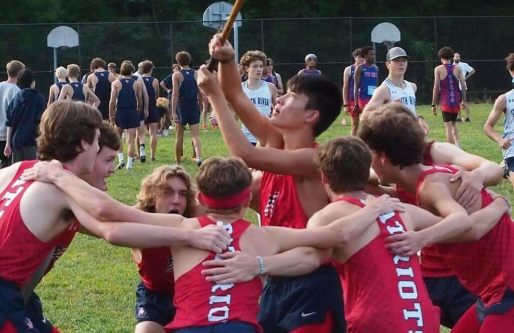 Northern High School's boys XC team rallying together before the 2024 Seahawk Invitational. 